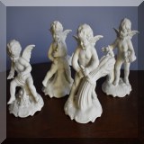 P23. Set of 4 Dresden Porcelain bisque angels representing the four seasons. Marked with crown D on bottom. 6”h - $95 